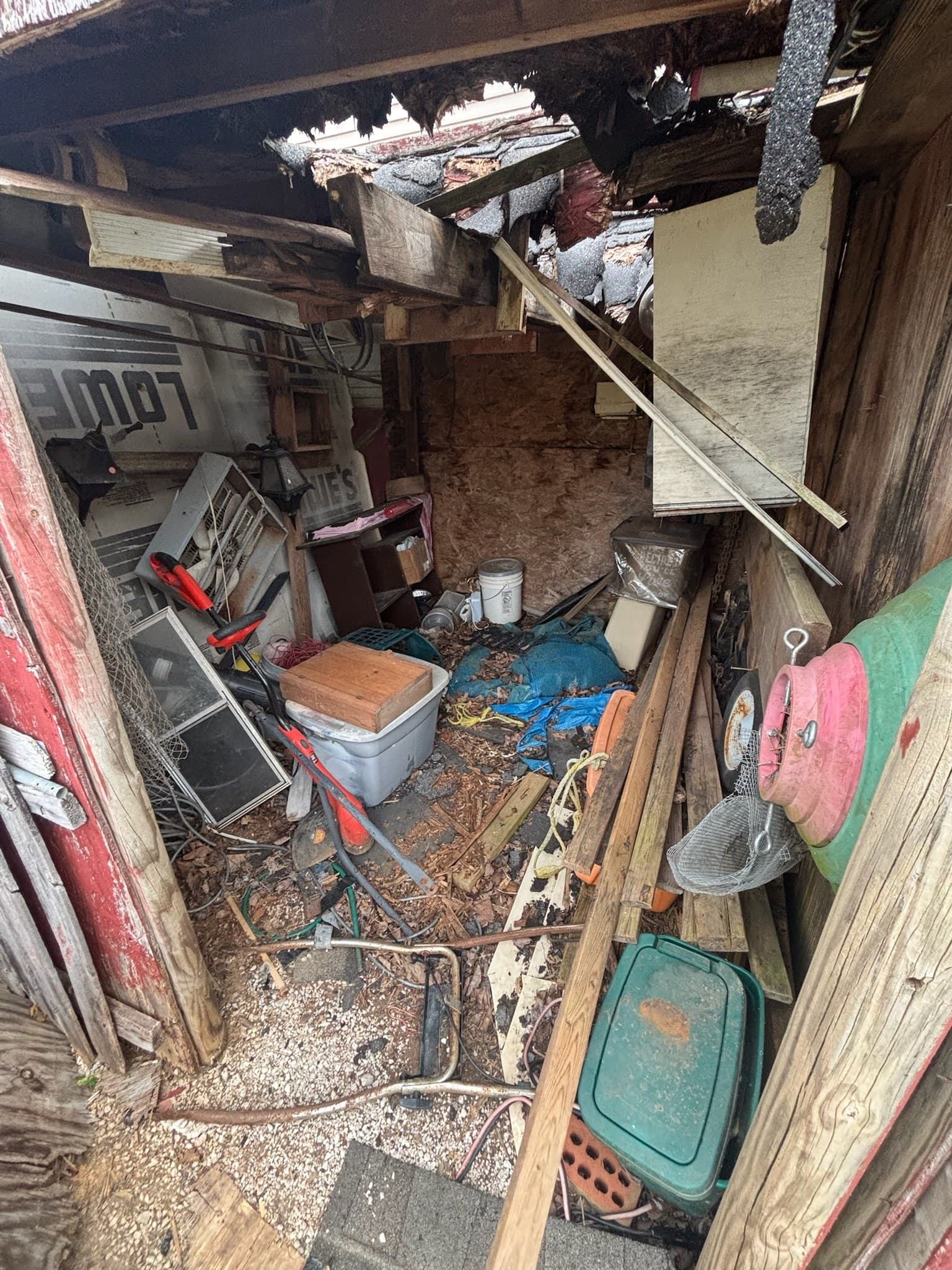 Packed carport before a Bag It Up cleanout
