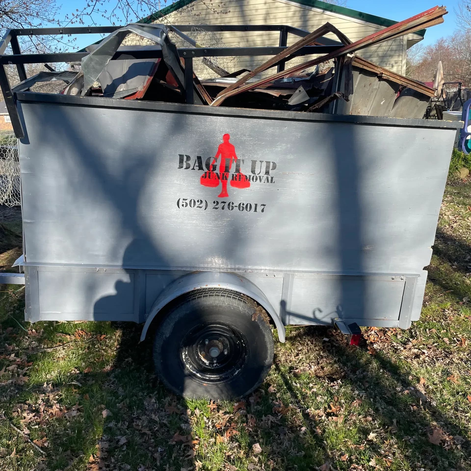 Bag It Up trailer loaded with demo debris