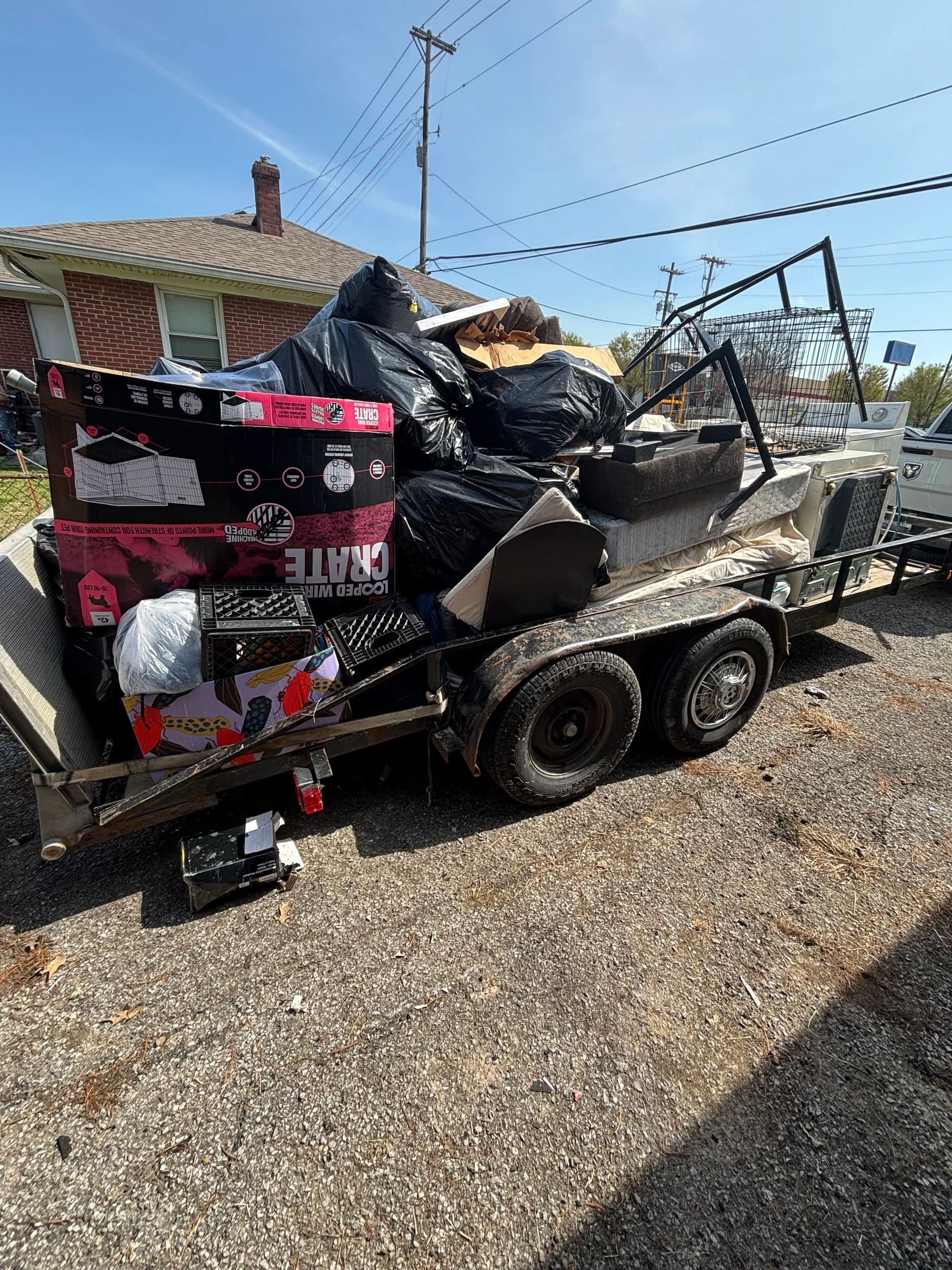 Bag It Up trailer loaded with household junk for removal